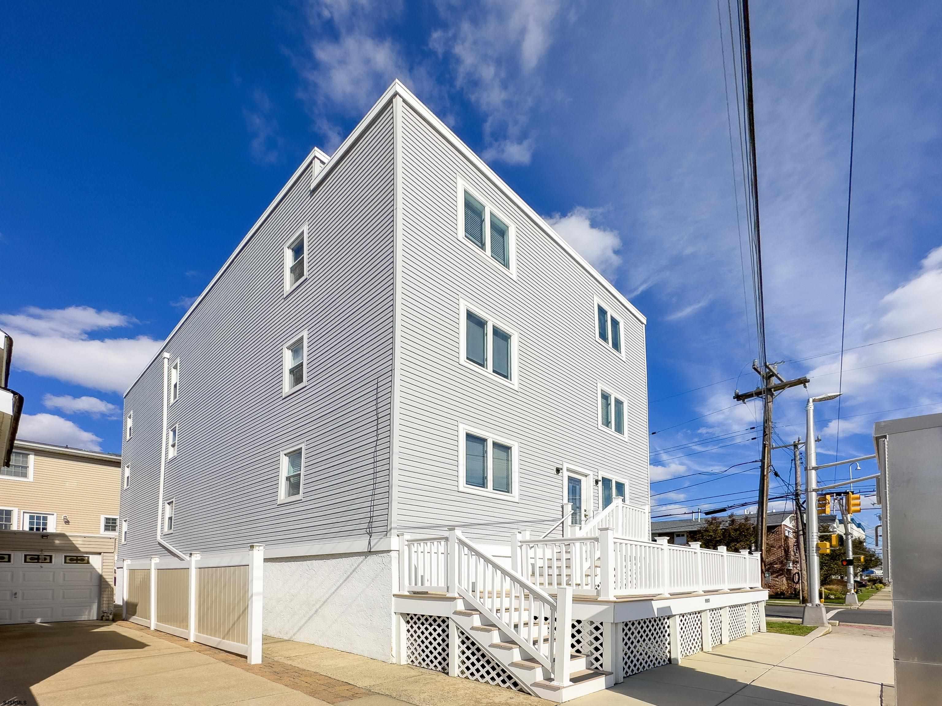 9801 Ventnor Avenue, Unit B1 Margate City, NJ 08402 - Photo 21 of 23 a front view of a building with many windows