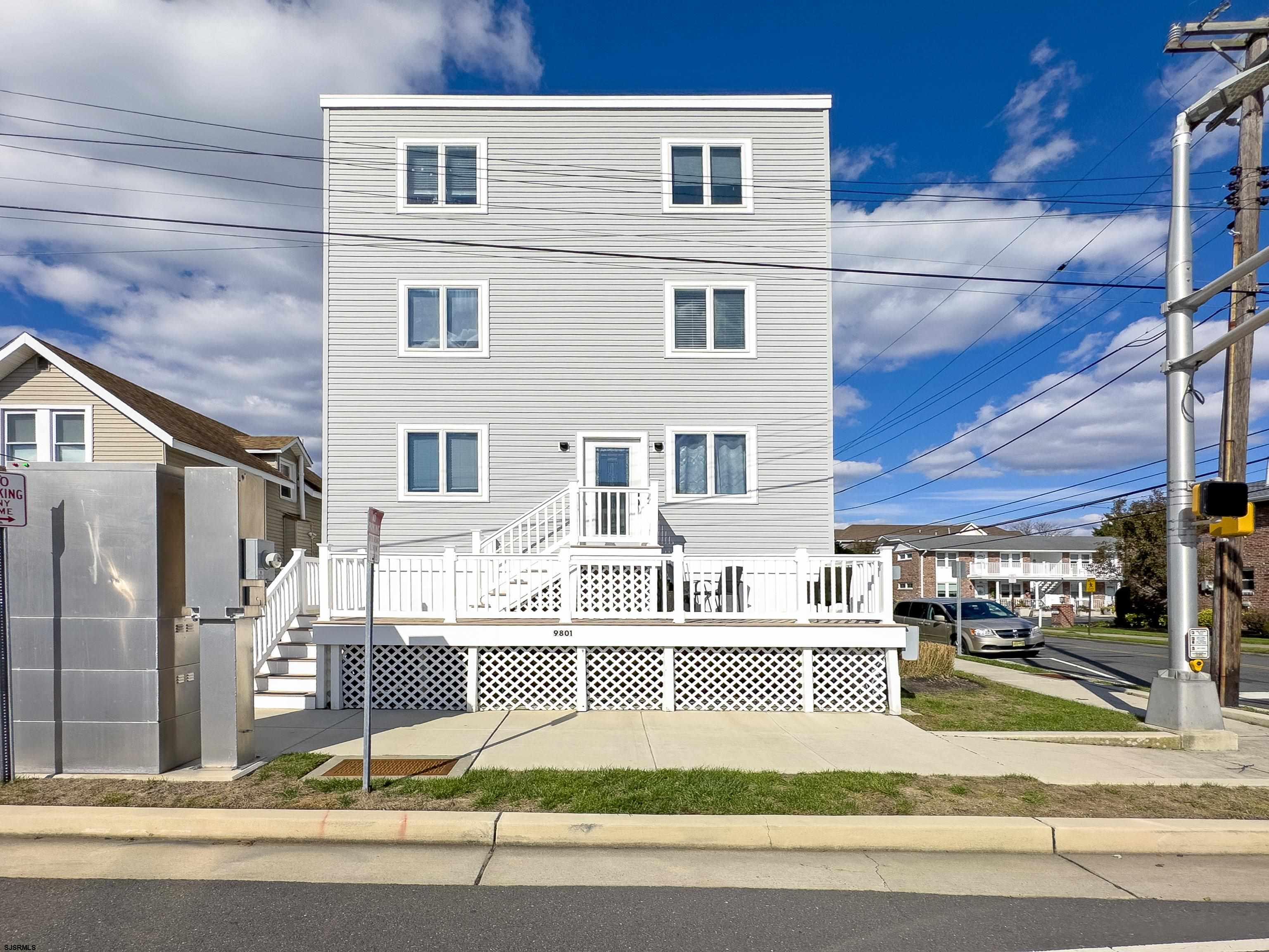 9801 Ventnor Avenue, Unit B1 Margate City, NJ 08402 - Photo 23 of 23 a view of a building with a yard