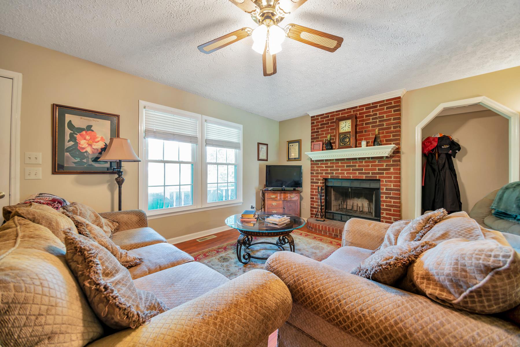 Living room. Door to right leads to upstairs bonus room.