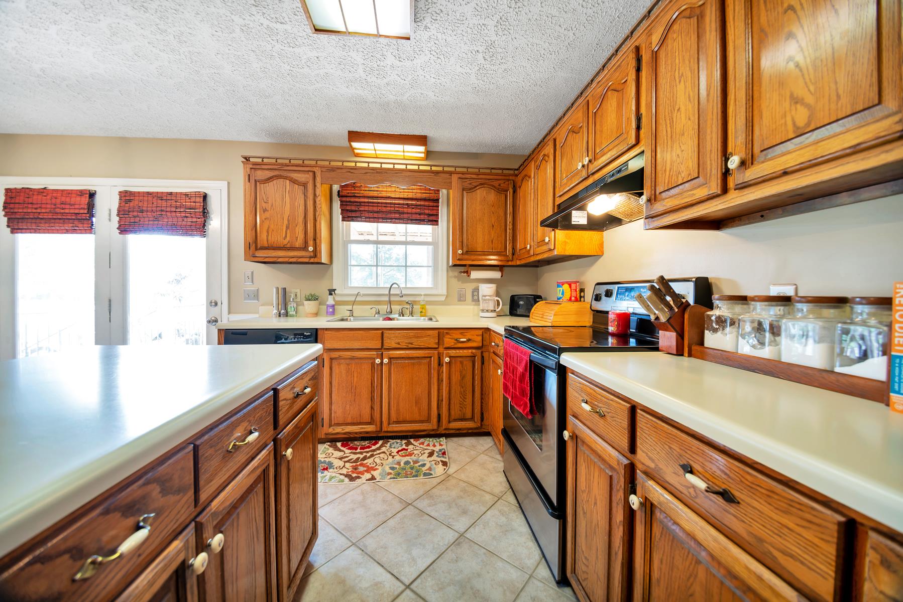 1115 Kathryn Road Mount Juliet, TN 37122 - Photo 8 of 21 Kitchen exits onto back porch and looks out onto back yard.