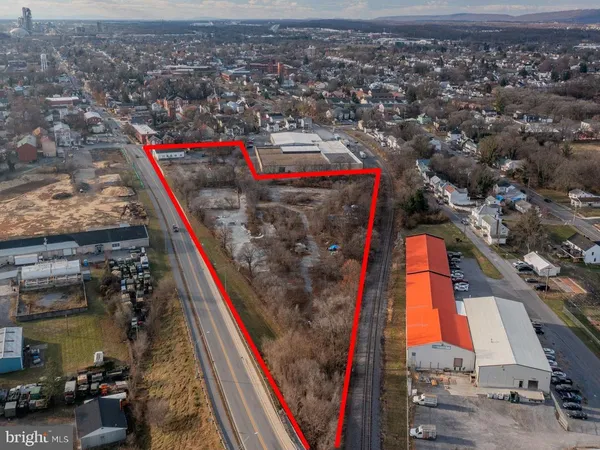 an aerial view of a houses with a road