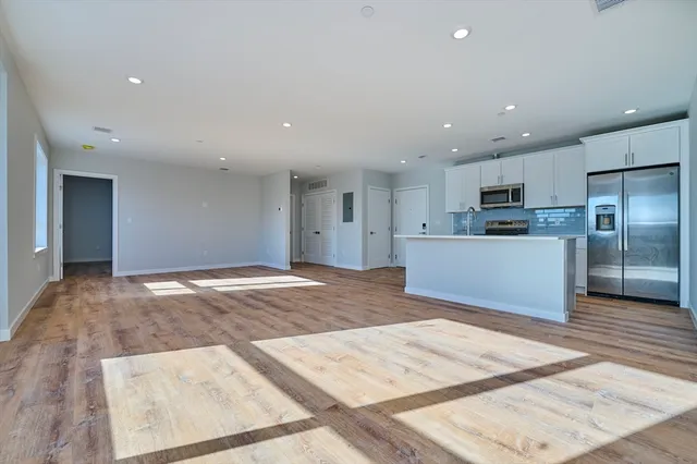 a view of kitchen with wooden floor