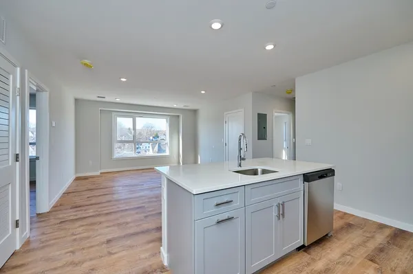 a kitchen with a sink and cabinets