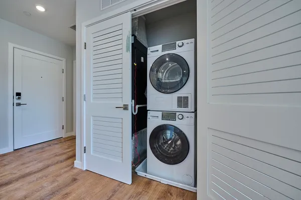 a view of a hallway with washer and dryer