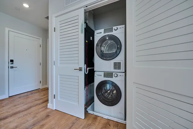 a view of a hallway with washer and dryer