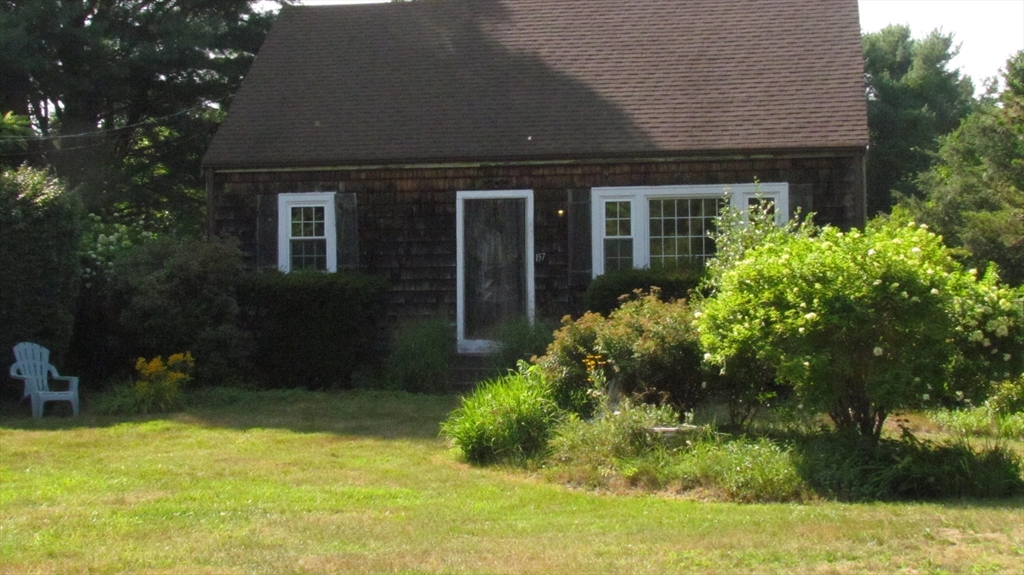 157 Wapping Road Kingston, MA 02364 - Photo 2 of 14 front view of house with a yard