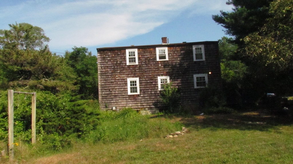 157 Wapping Road Kingston, MA 02364 - Photo 4 of 14 a brick house with a yard