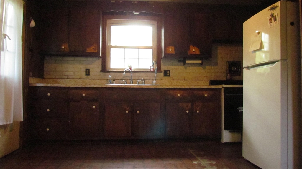 157 Wapping Road Kingston, MA 02364 - Photo 8 of 14 a kitchen with a sink and a window