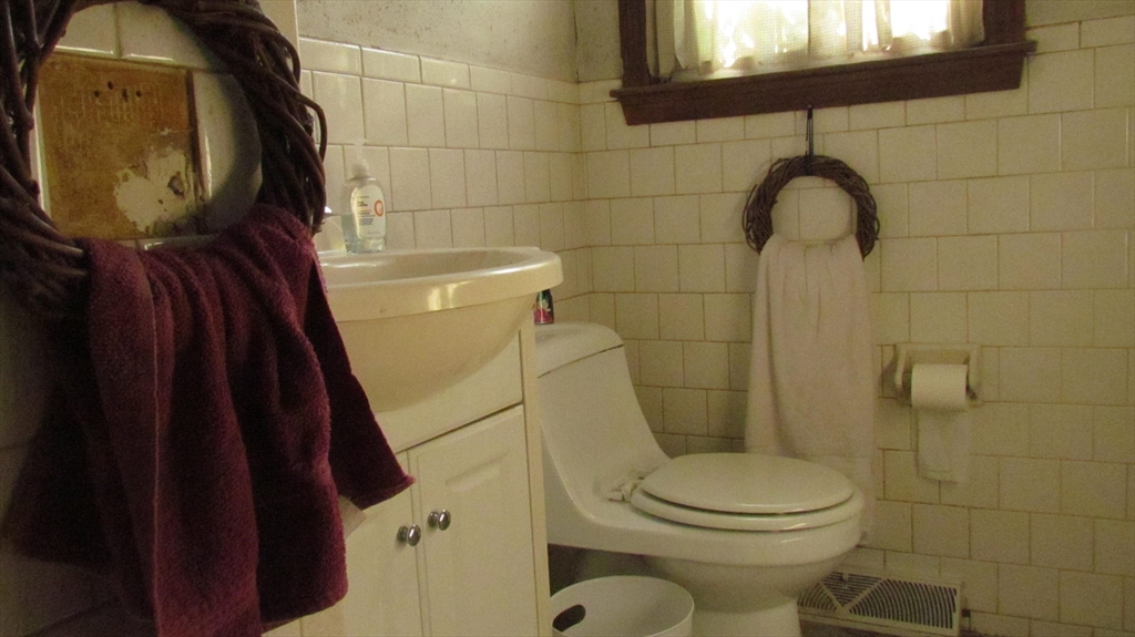 157 Wapping Road Kingston, MA 02364 - Photo 10 of 14 a bathroom with a toilet and a mirror