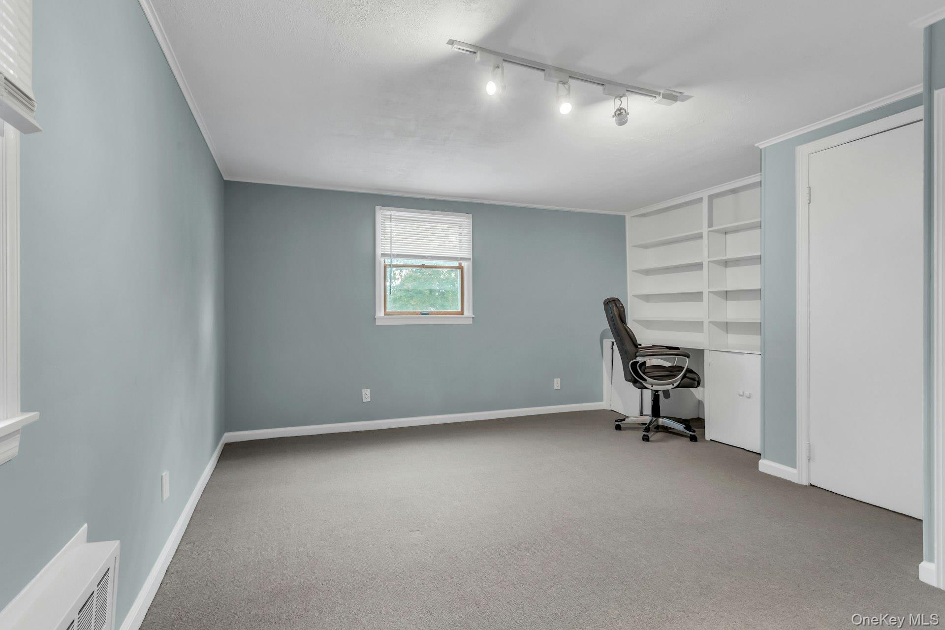 4 Timber Road Glen Cove, NY 11542 - Photo 19 of 30 a view of an empty room with a window
