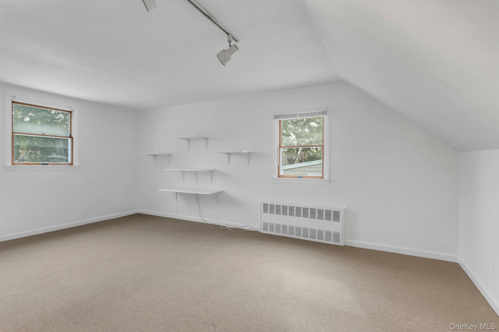 4 Timber Road Glen Cove, NY 11542 - Photo 20 of 30 an empty room with a empty space and windows