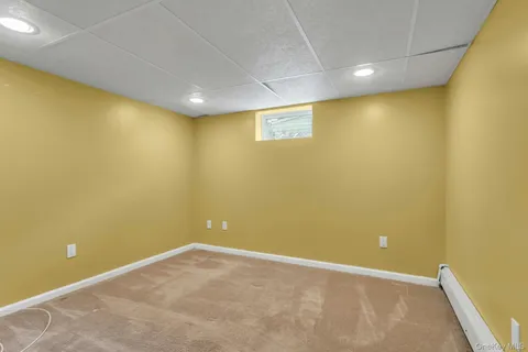 a kitchen with a sink a refrigerator and cabinets