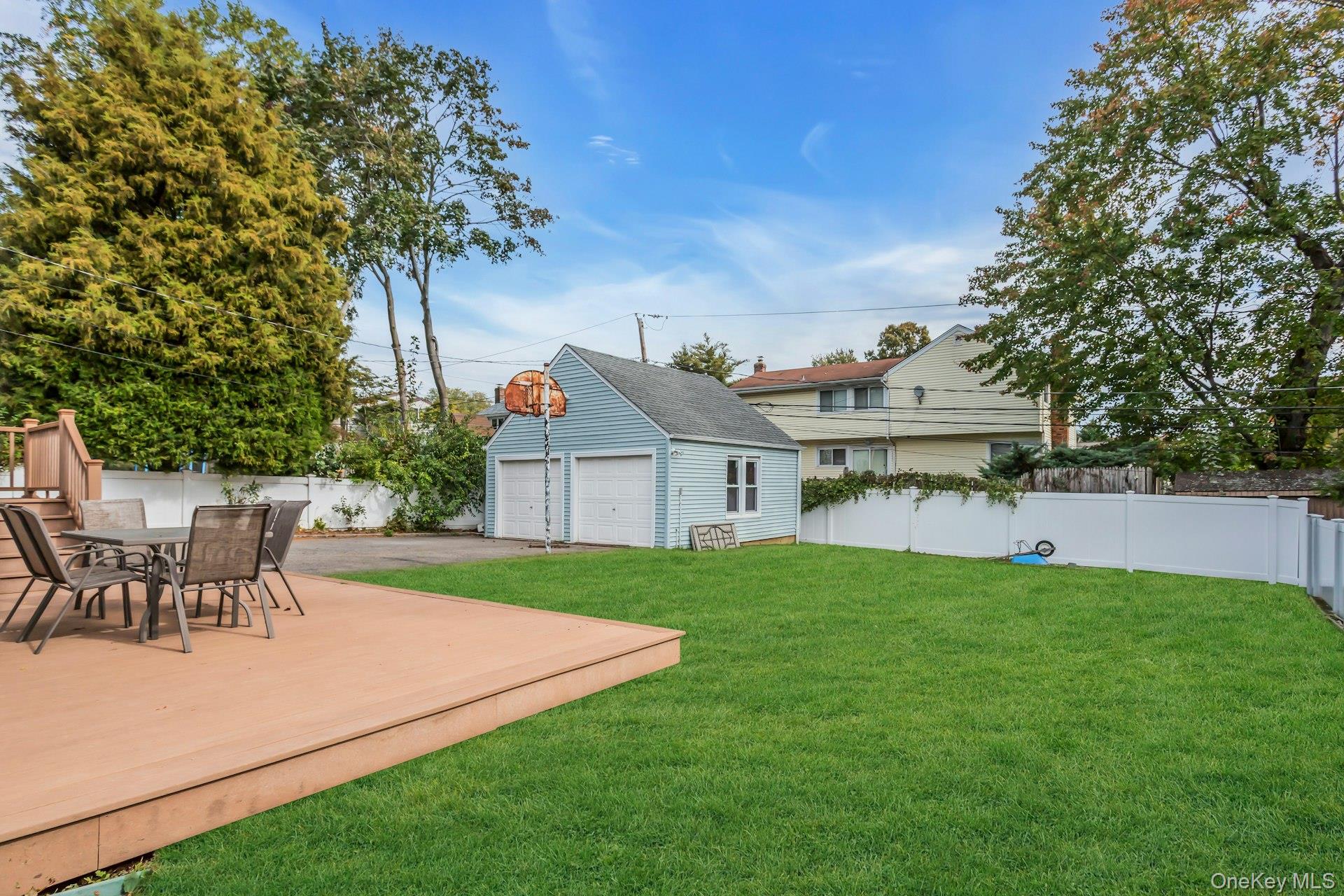 4 Timber Road Glen Cove, NY 11542 - Photo 28 of 30 a view of a house with a yard and sitting area