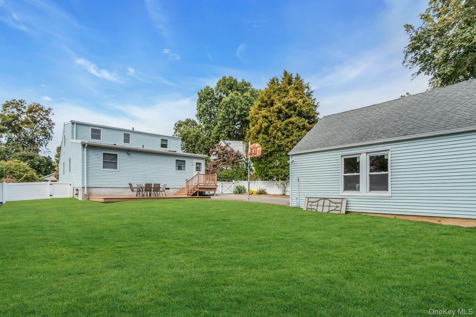 4 Timber Road Glen Cove, NY 11542 - Photo 29 of 30 a front view of house with yard and trees