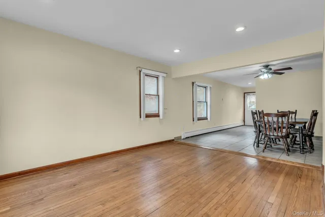 a front view of house with yard and trees