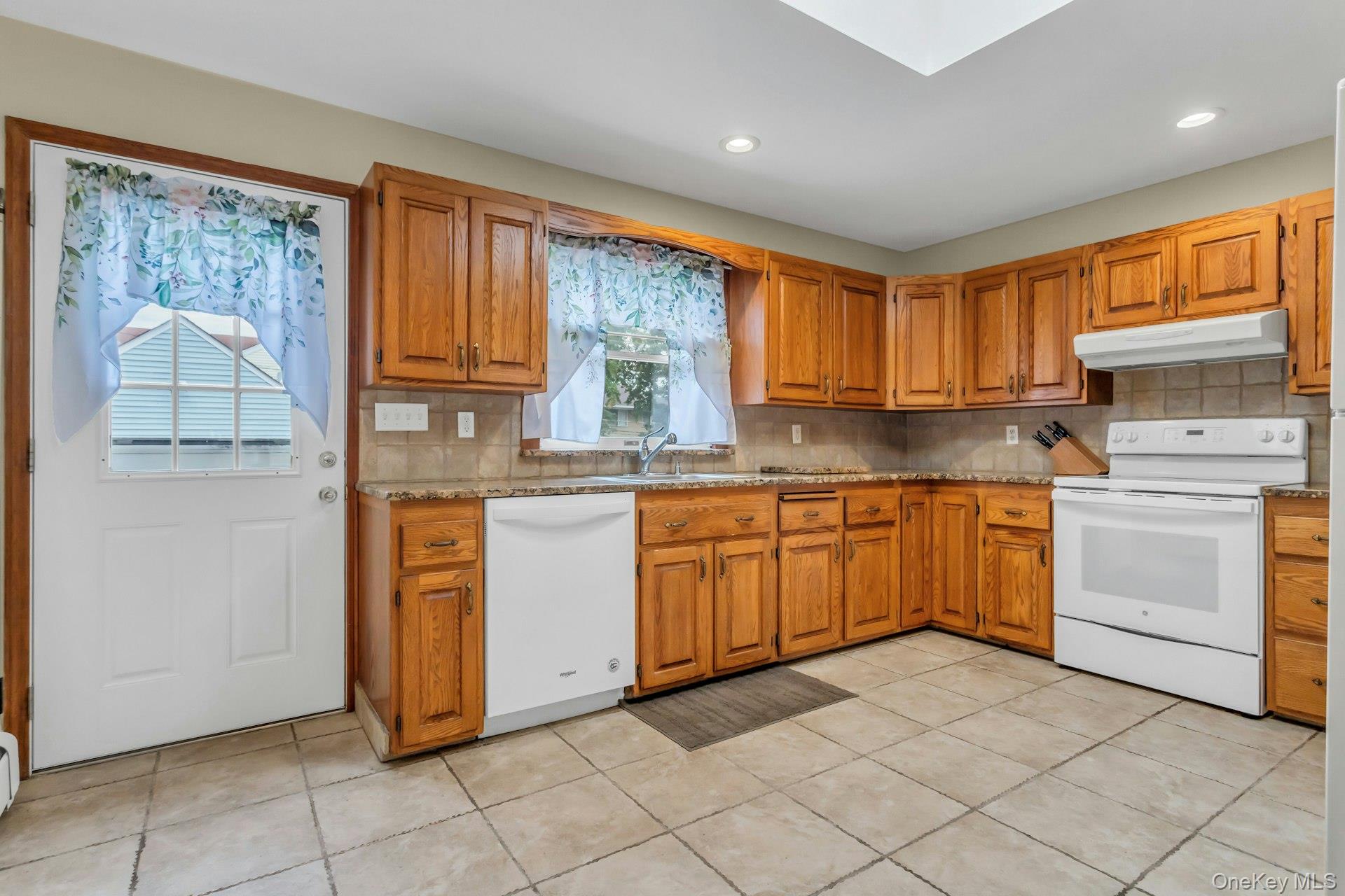 4 Timber Road Glen Cove, NY 11542 - Photo 8 of 30 a kitchen with a stove sink and cabinets
