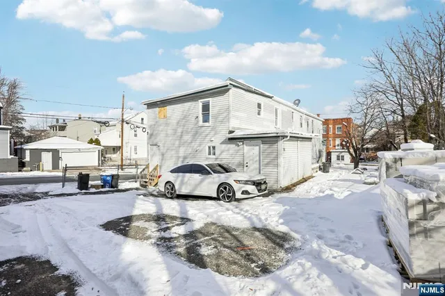 a view of a cars park in front of house