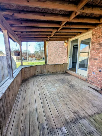 a view of outdoor space with wooden floor