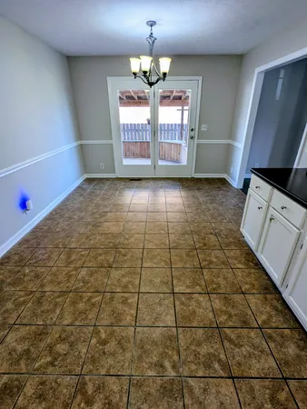 a view of empty room with windows