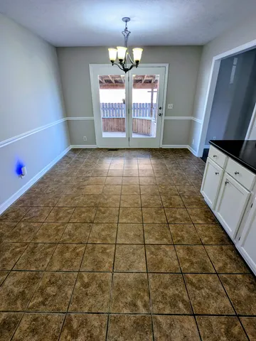 a view of empty room with windows