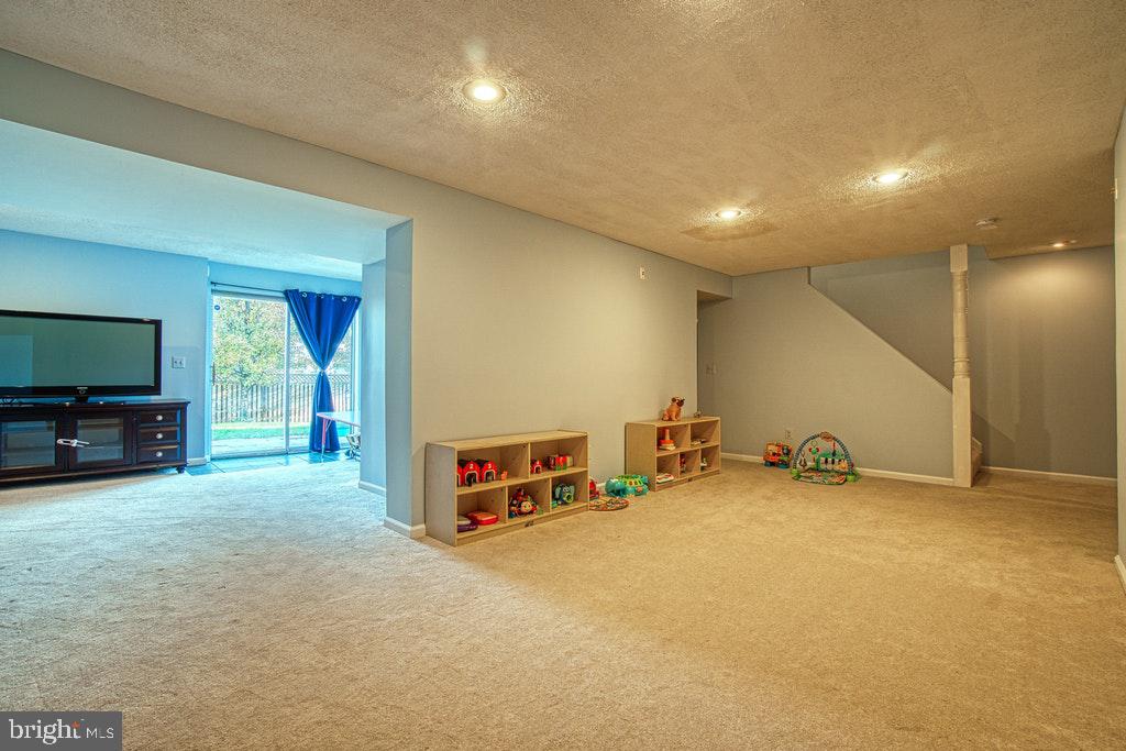 1940 East Beech Road Sterling, VA 20164 - Photo 23 of 27 Lower Level family room w/ walk out basement