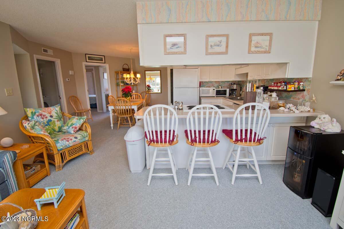 9201 Coast Guard Road, Unit B203 Emerald Isle, NC 28594 - Photo 17 of 37 living room deck