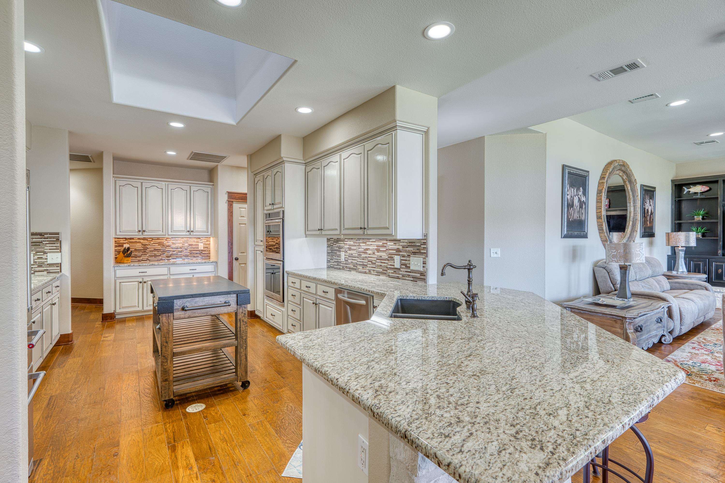 206 River Ranch Road Kingsland, TX 78639 - Photo 11 of 30 a kitchen with counter top space and living room