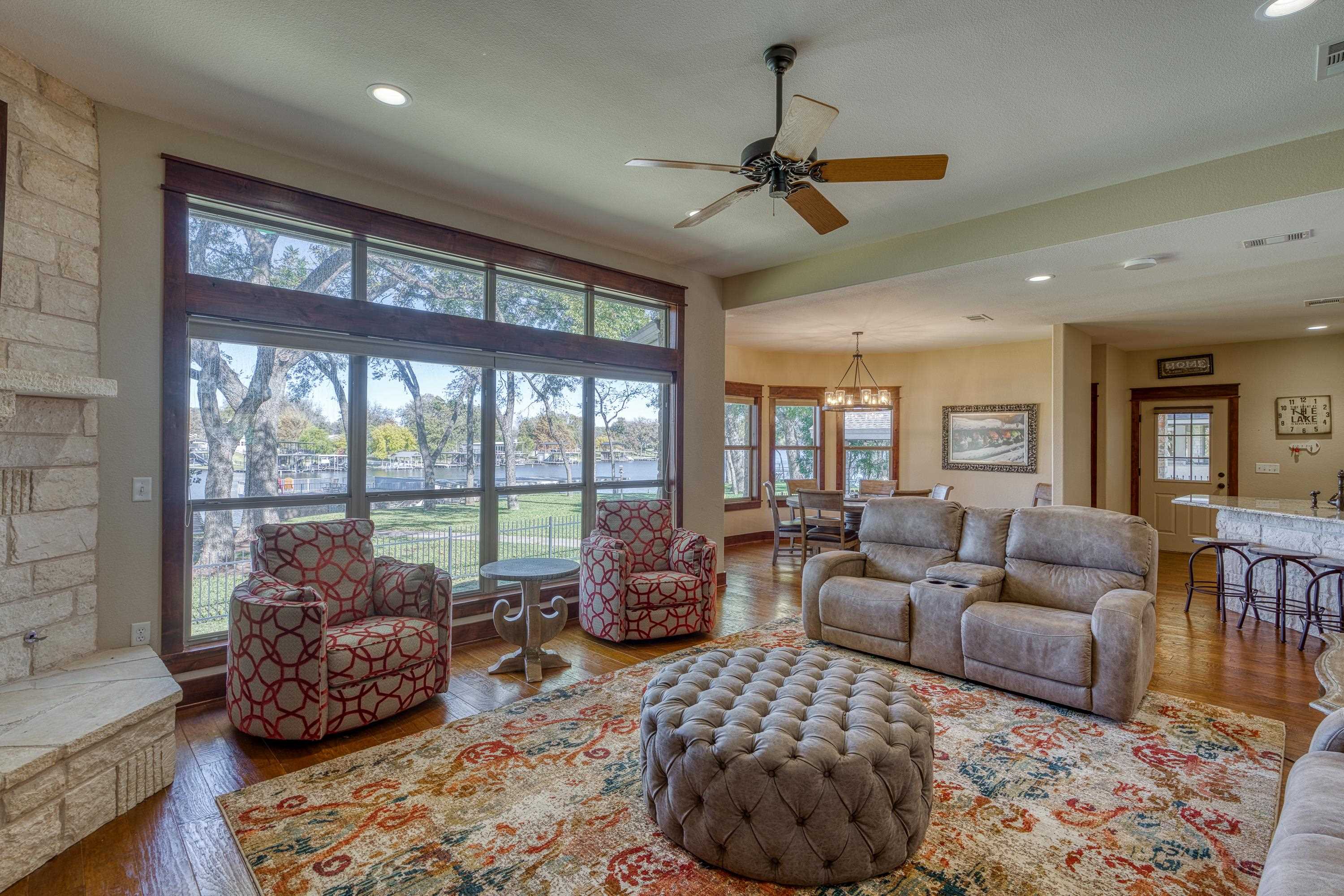206 River Ranch Road Kingsland, TX 78639 - Photo 14 of 30 a living room with furniture and a large window