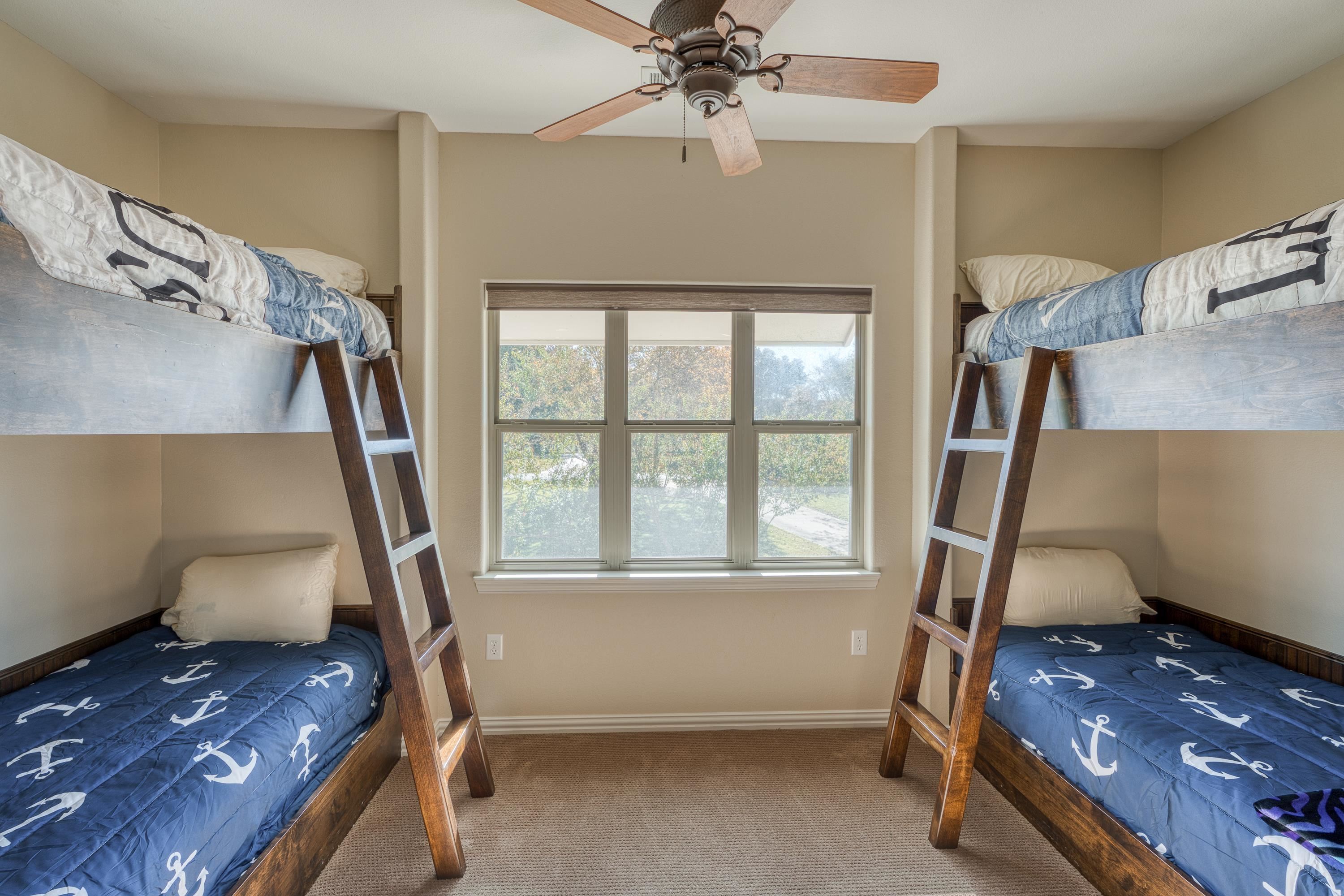 206 River Ranch Road Kingsland, TX 78639 - Photo 22 of 30 a bedroom with a bed and a window