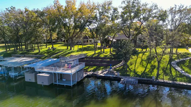 an aerial view of residential houses with outdoor space