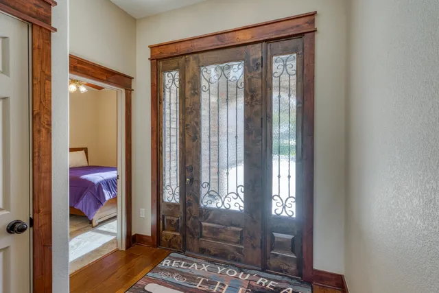 a bedroom with a bed and a lamp on table