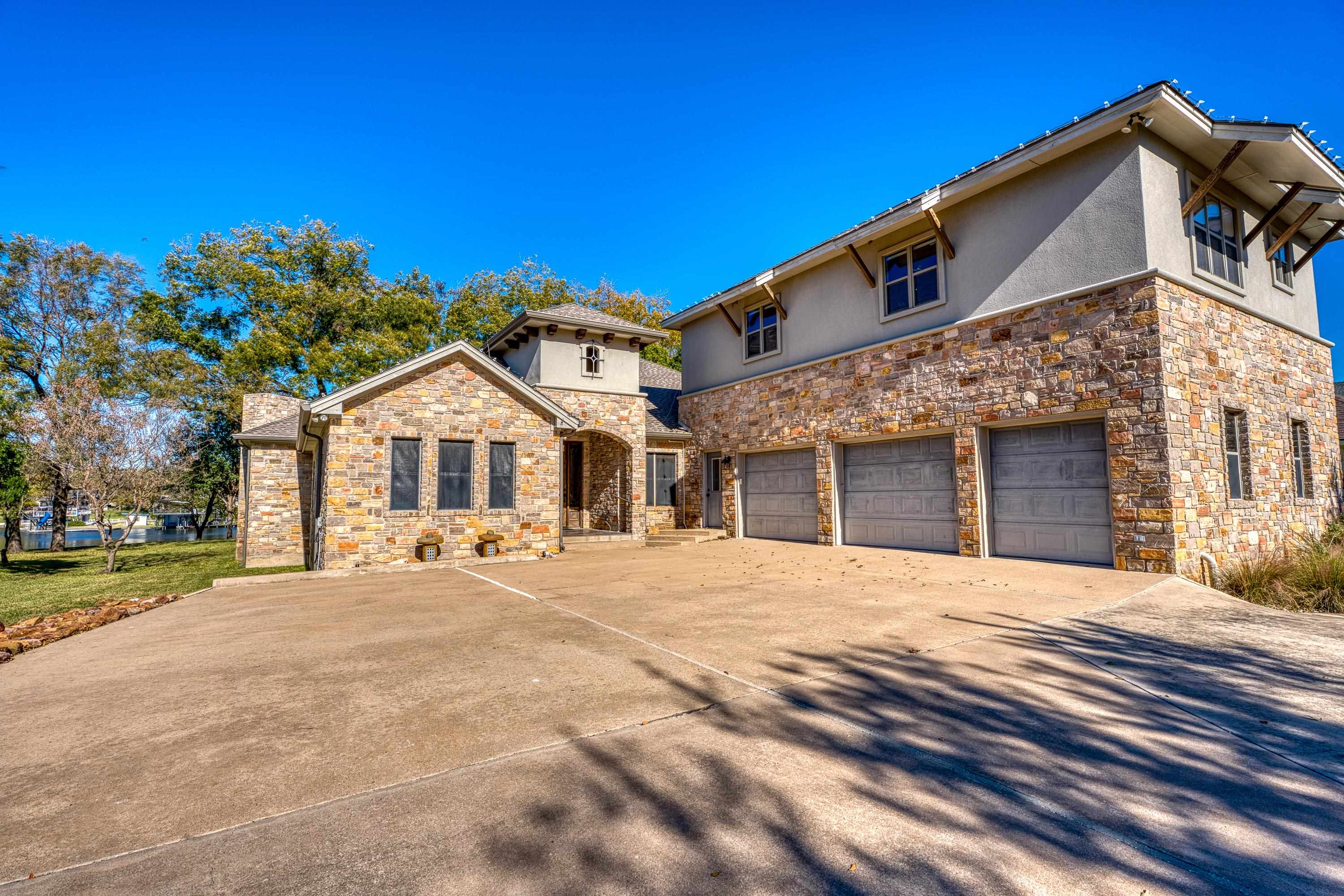 206 River Ranch Road Kingsland, TX 78639 - Photo 7 of 30 a front view of a house with a yard