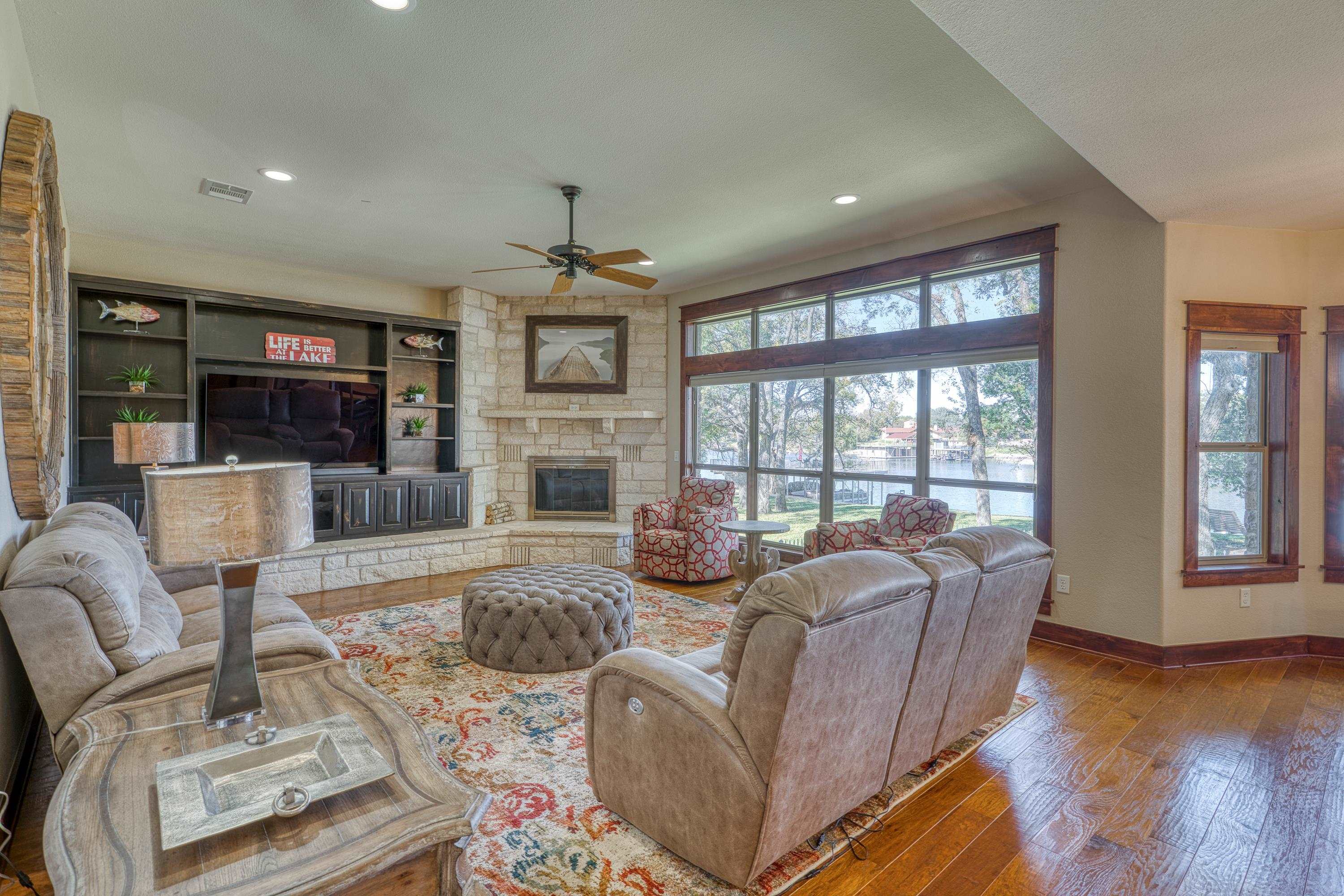 206 River Ranch Road Kingsland, TX 78639 - Photo 8 of 30 a living room with furniture large window and wooden floor