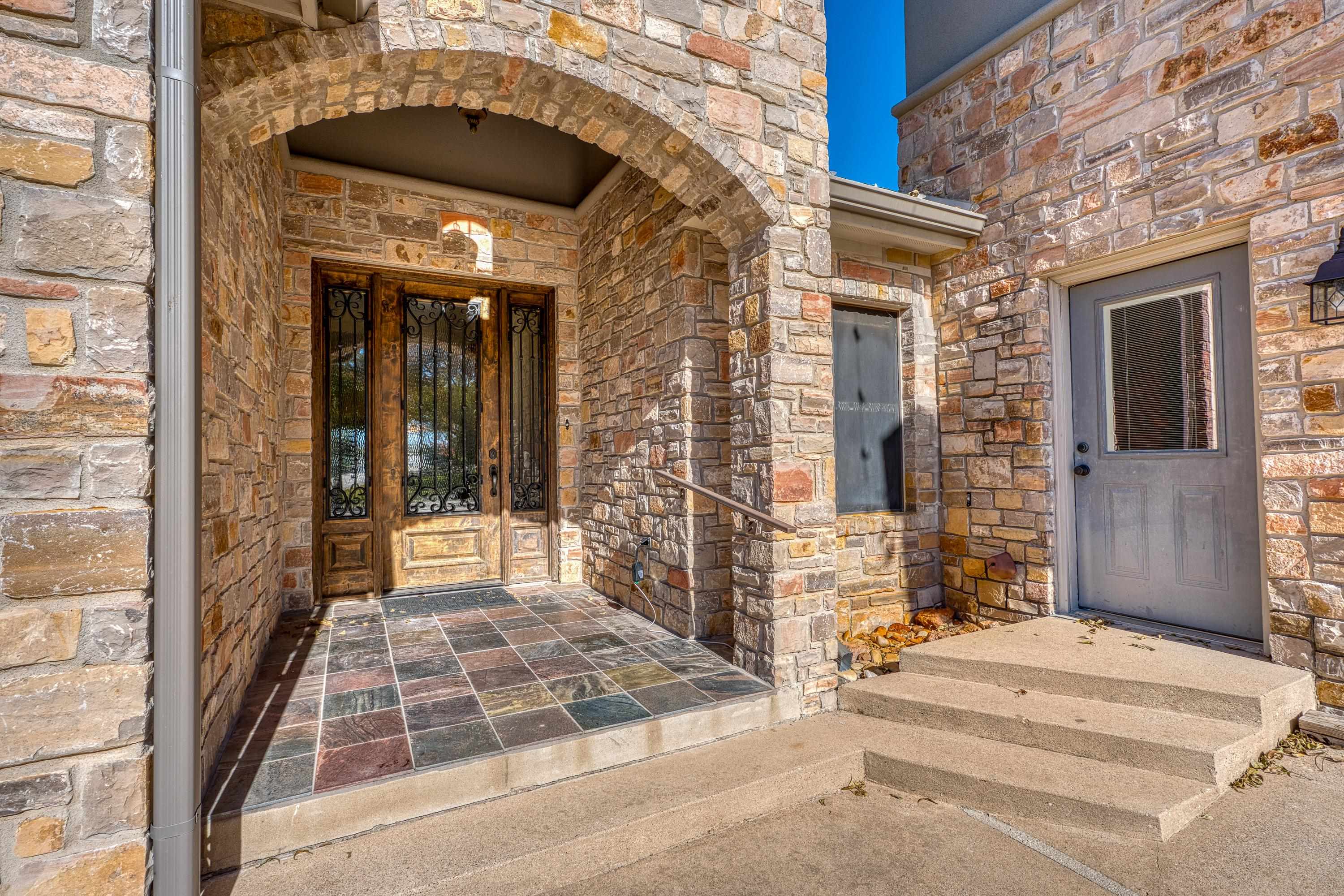 206 River Ranch Road Kingsland, TX 78639 - Photo 8 of 30 a view of a brick house with large windows
