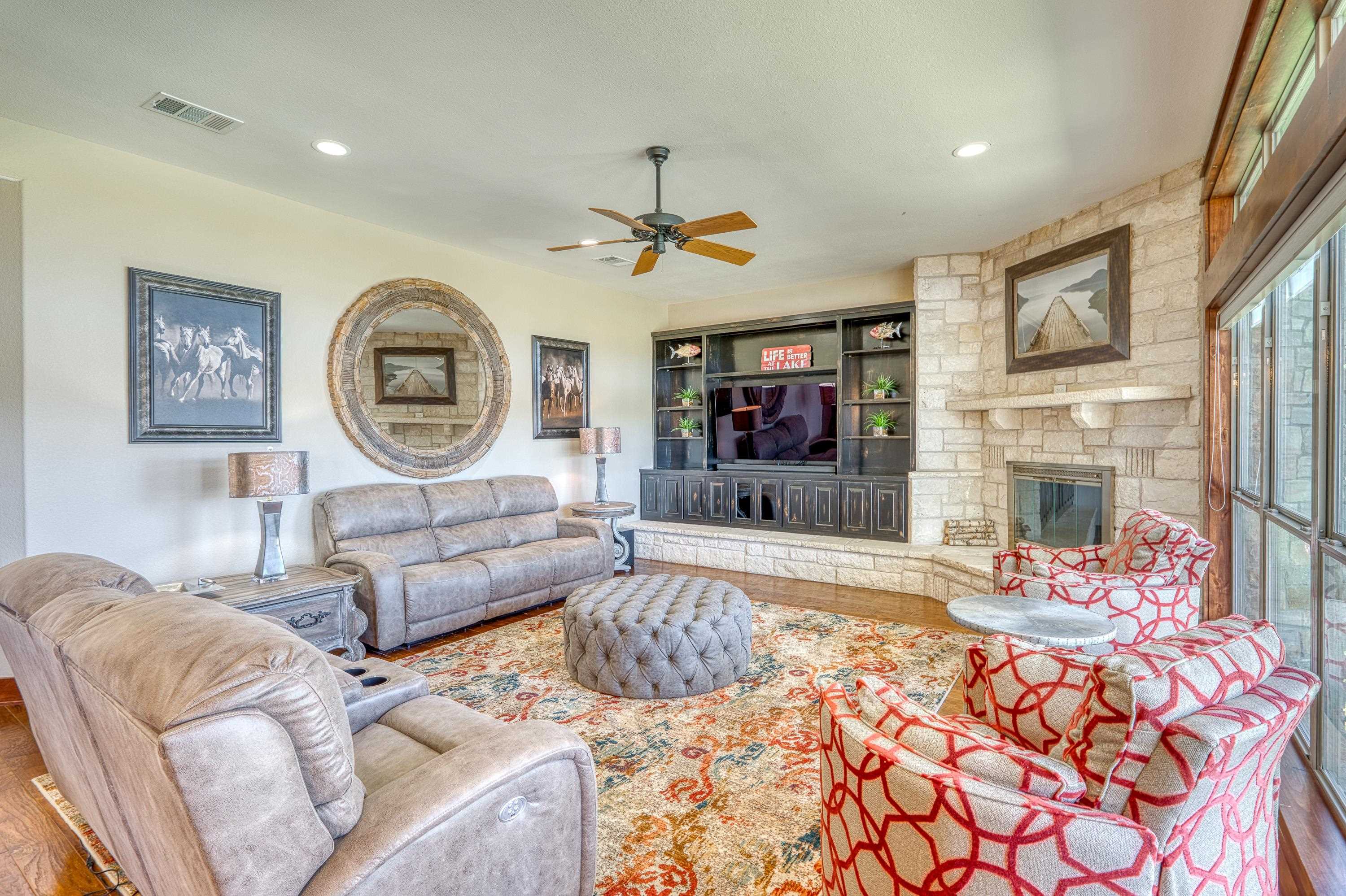 206 River Ranch Road Kingsland, TX 78639 - Photo 10 of 30 a living room with fireplace furniture and a flat screen tv