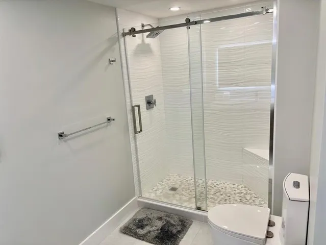 a bathroom with a bathtub and a shower