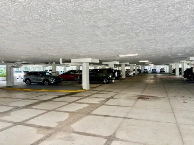 a view of parking with cars parked
