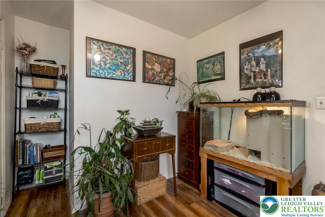 365 Rock Street Easton, PA 18042 - Photo 21 of 50 Natural light illuminates a cozy corner with lustrous wood flooring and neatly arranged storage.