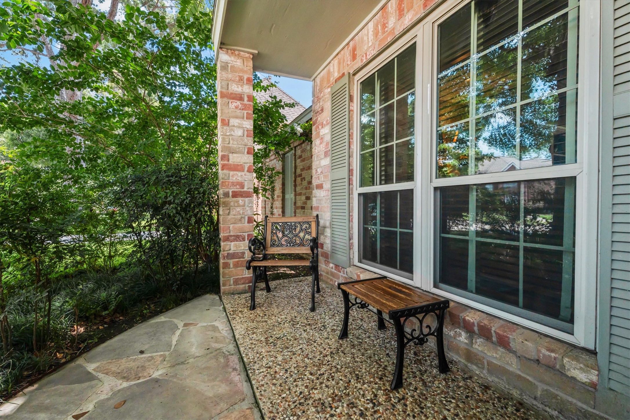 9103 Herts Road Spring, TX 77379 - Photo 3 of 46 A covered front porch surrounded by greenery makes the perfect spot for your morning coffee - you might almost feel like you're on vacation!