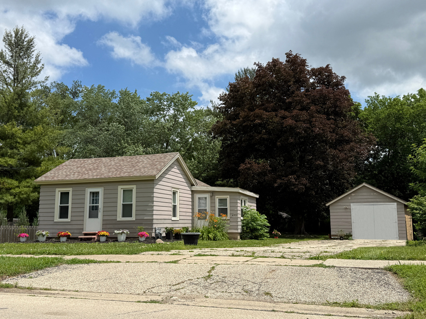 423 Maple Street Marengo, IL 60152 - Photo 16 of 17 a front view of a house with a garden