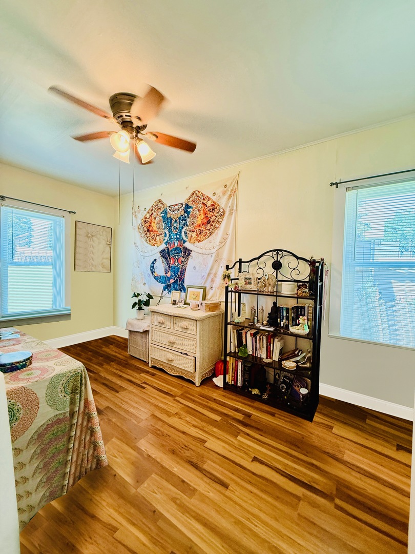 423 Maple Street Marengo, IL 60152 - Photo 17 of 17 a bedroom with a bed and a chandelier