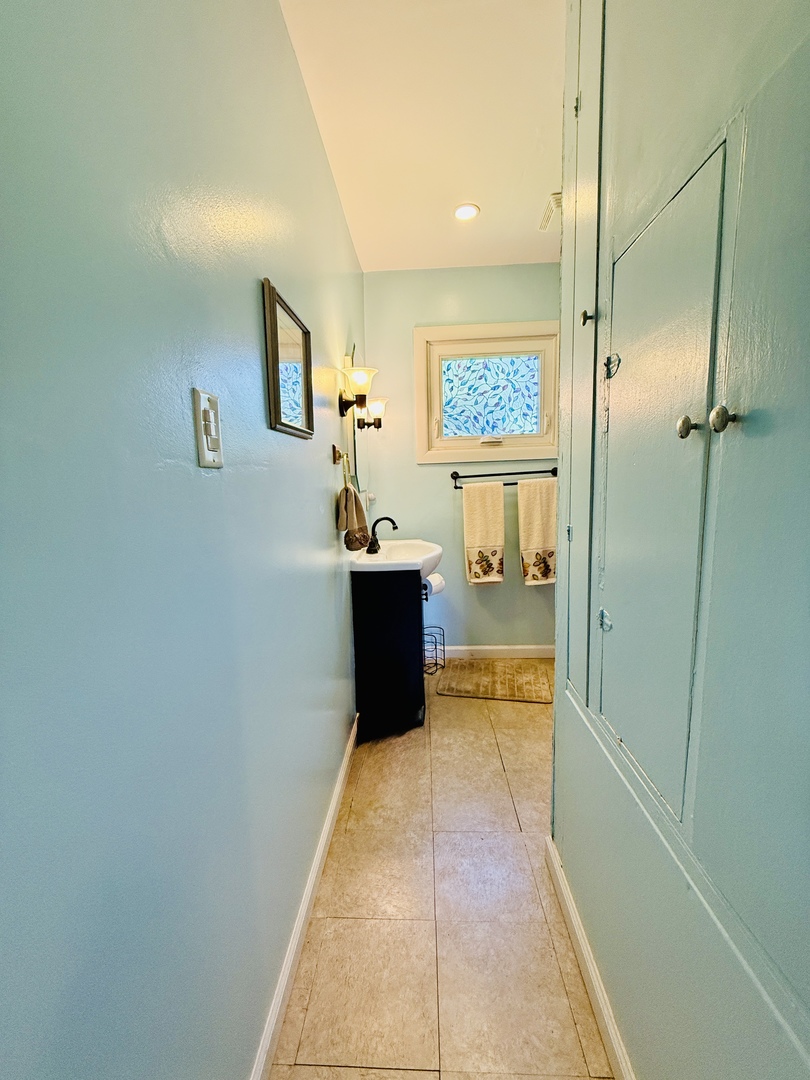 423 Maple Street Marengo, IL 60152 - Photo 10 of 17 a bathroom with a bathtub and a shower