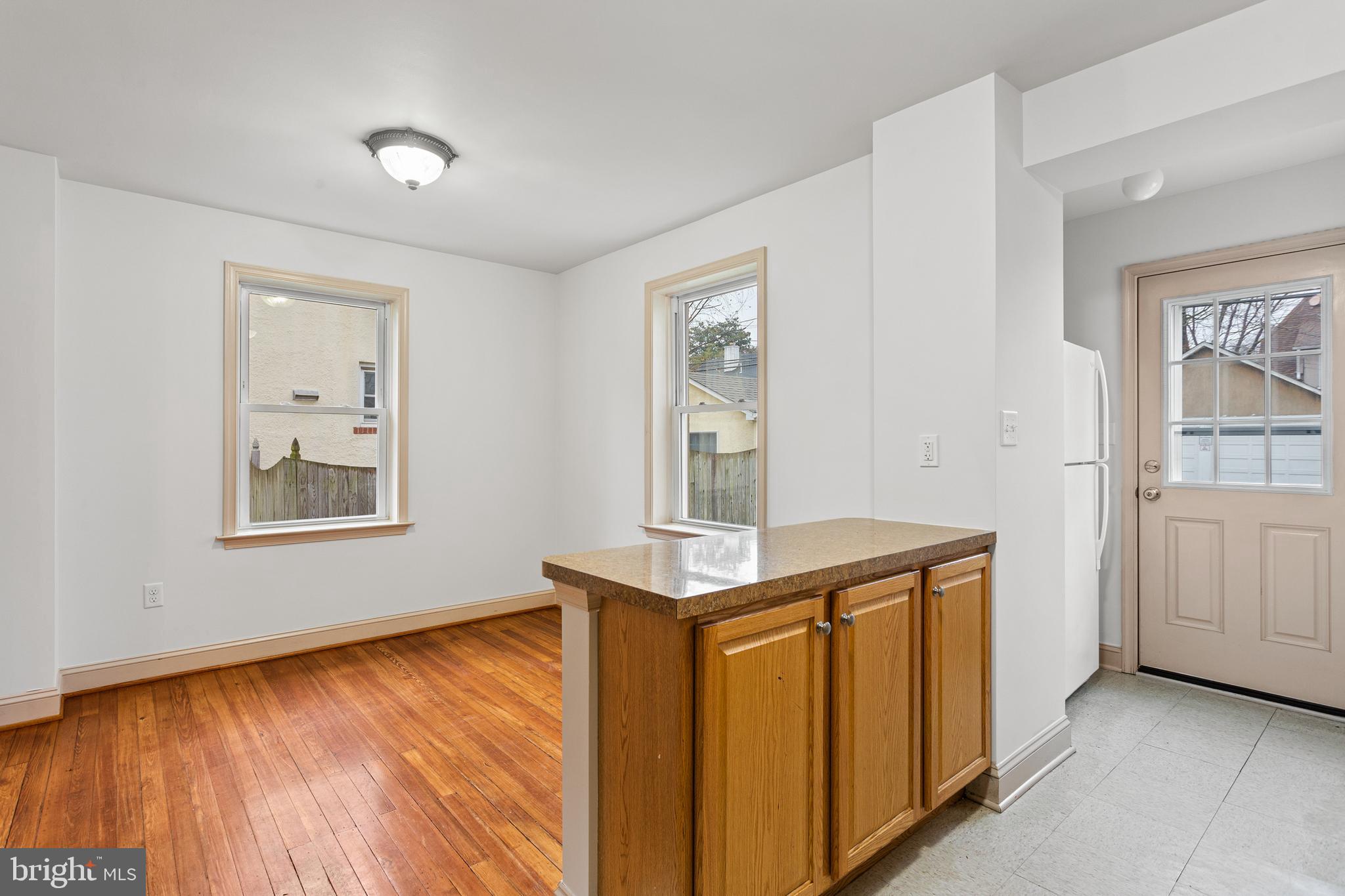 74 Kinship Road Dundalk, MD 21222 - Photo 11 of 29 Kitchen peninsula overlooking Dining Room