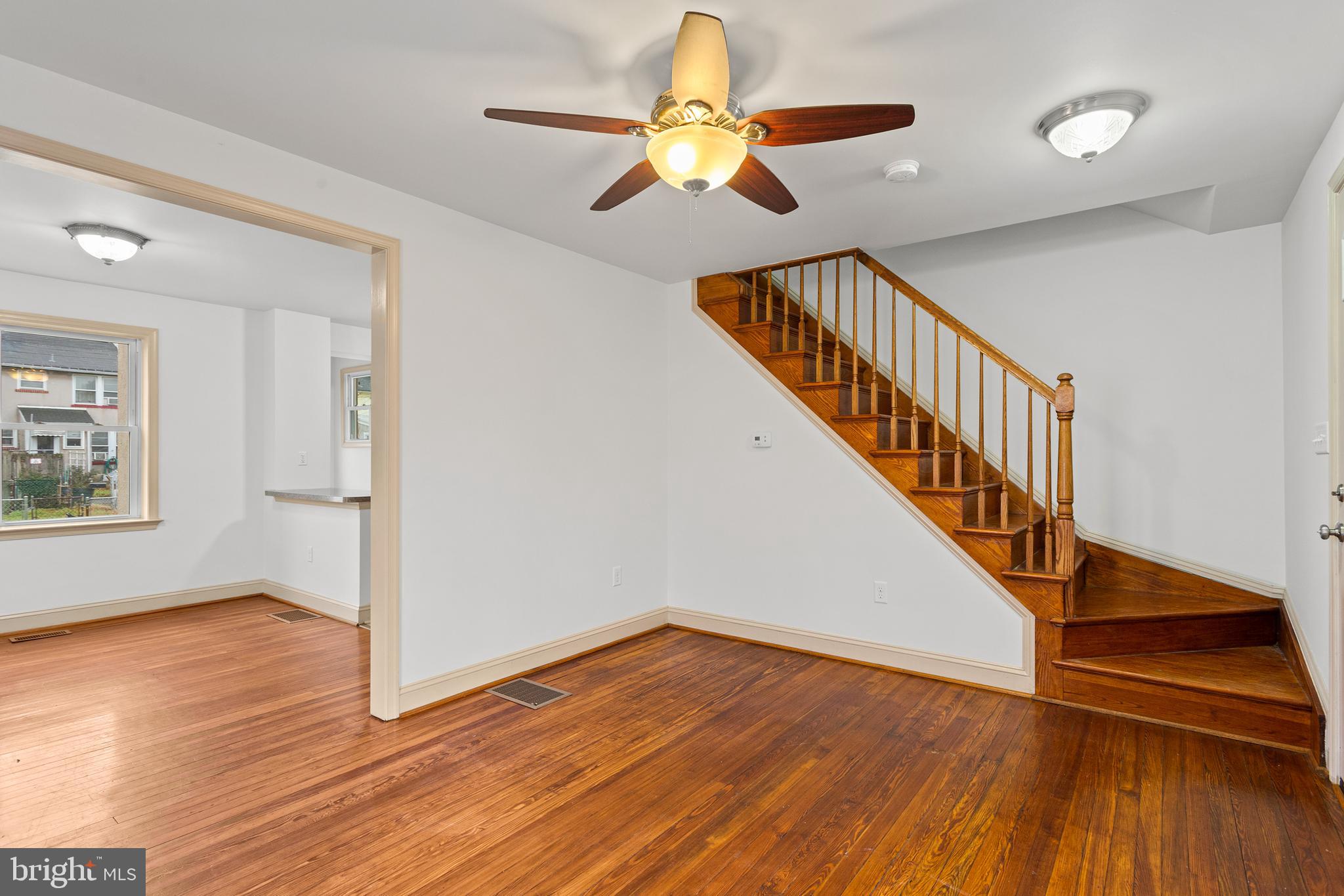74 Kinship Road Dundalk, MD 21222 - Photo 13 of 29 Living Room - Hardwood stairs to second level