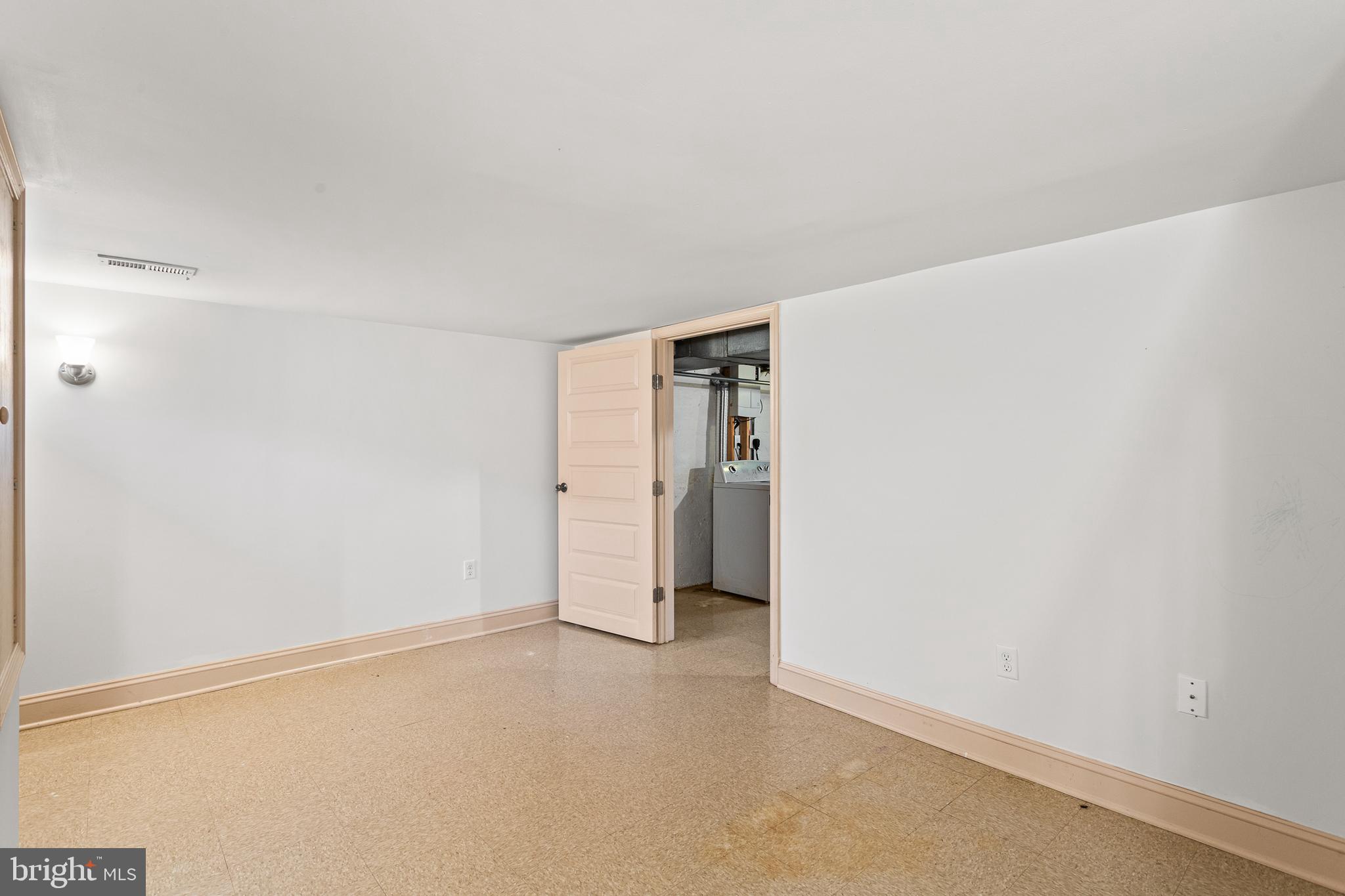 74 Kinship Road Dundalk, MD 21222 - Photo 23 of 29 Lower Level Family room - Access to utility room