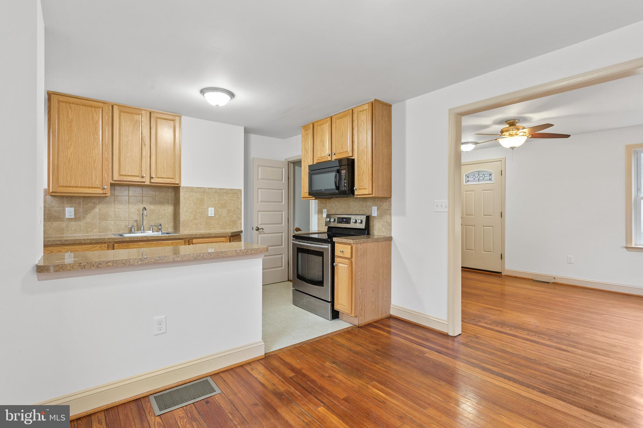 74 Kinship Road Dundalk, MD 21222 - Photo 7 of 29 Dining Room opens to Galley Kitchen