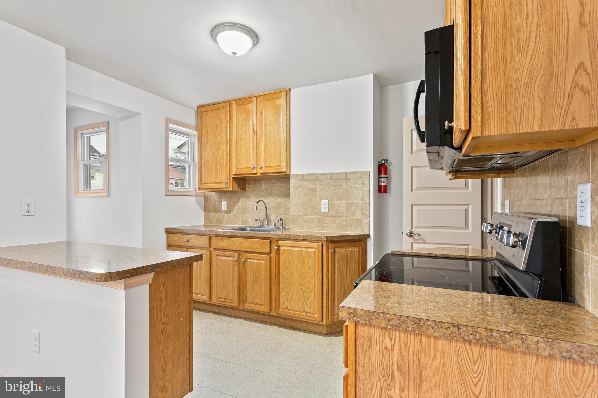 74 Kinship Road Dundalk, MD 21222 - Photo 8 of 29 Kitchen with tile backsplash