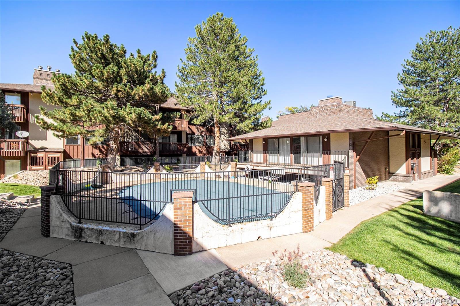 500 Manhattan Drive, Unit B1 Boulder, CO 80303 - Photo 22 of 24 a view of outdoor space yard deck patio and fire pit