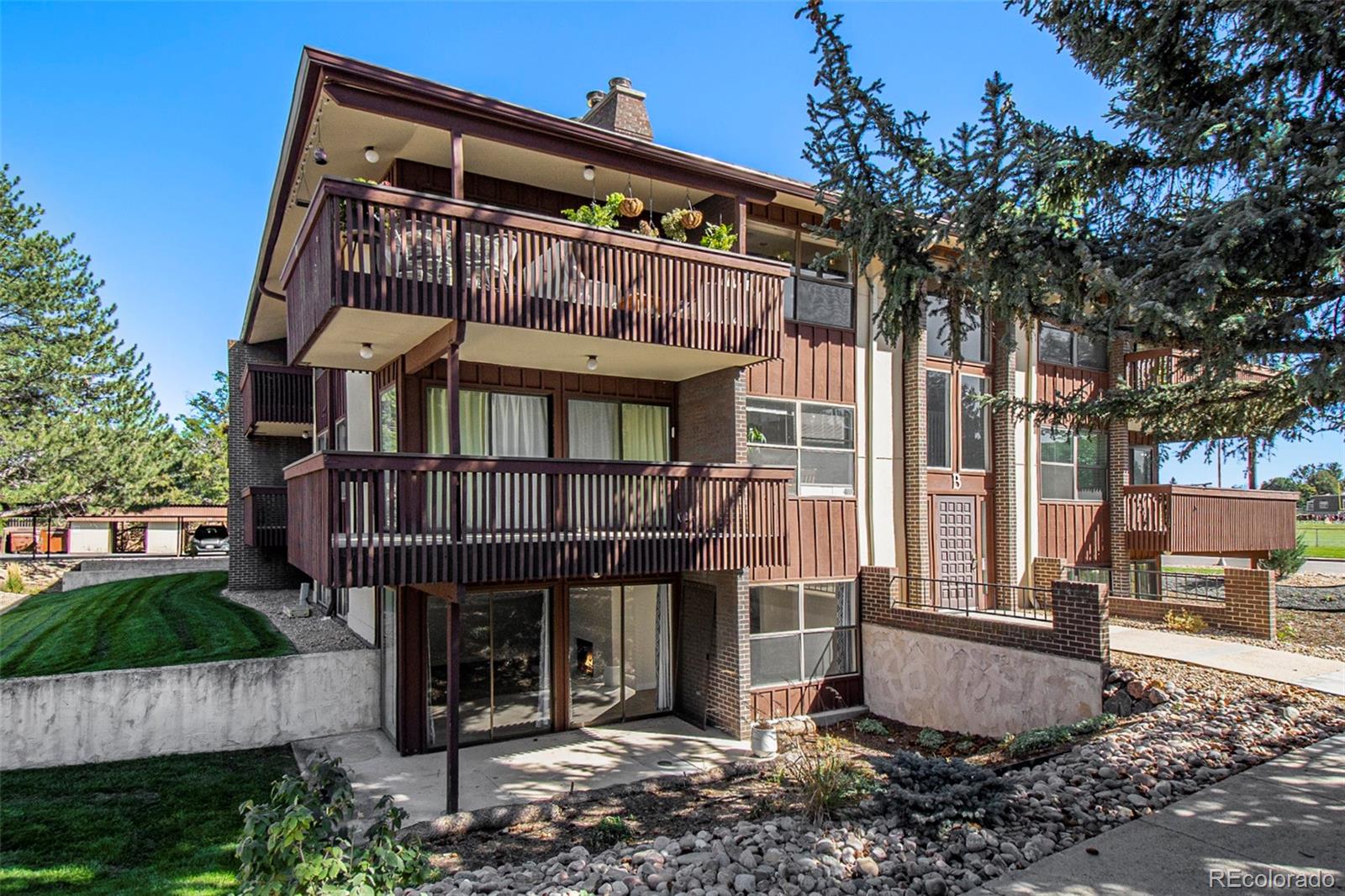 500 Manhattan Drive, Unit B1 Boulder, CO 80303 - Photo 24 of 24 a front view of a house with a yard
