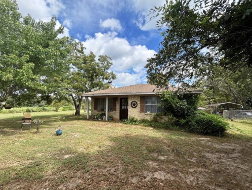 8351 Farm To Market 3 Marquez, TX 77865 - Photo 2 of 8 a front view of a house with a yard